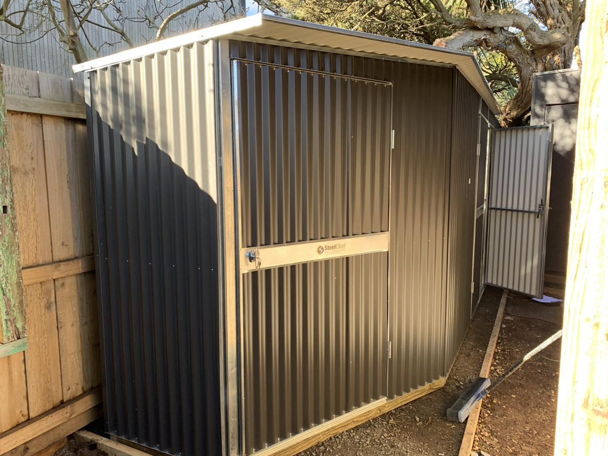 Custom corrugated garden shed in tight space