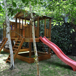 Tree house cubby with playground and slide